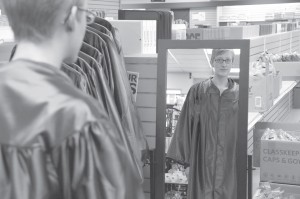 graduation student looking in mirror