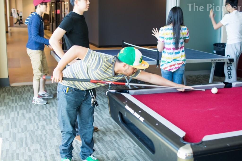 Bryan Abejon about to shoot some pool at the game day