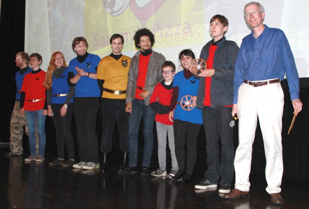 Executive Director of the Grand Cinema, Philip Cowan gives actors and filmmakers of the short ‘Astronave’ their awards for best 72 hour film and best product placement in the 2014 72 hour Film Competition.
